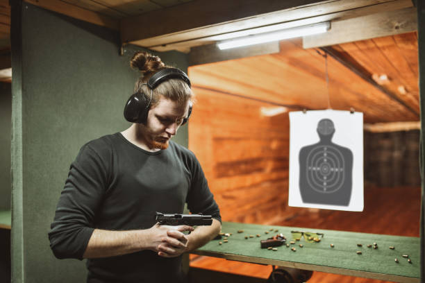 istock Male Gun Operator And His Firearm Of Choice 1313321506