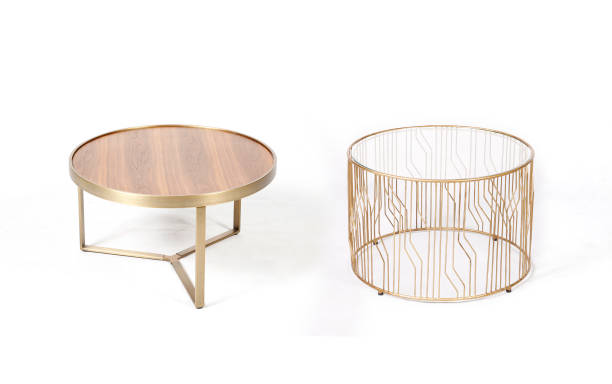 istock Two modern metal golden coffee tables isolated on white background 1313321568