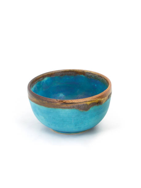 istock Blue hand made clay bowl isolated on white background 1313321597