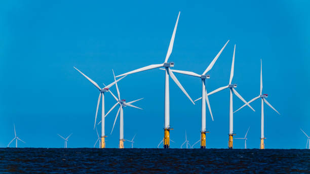 Large Offshore wind turbines farm in the North Sea Large Offshore wind turbines farm in the North Sea offshore wind farm stock pictures, royalty-free photos & images
