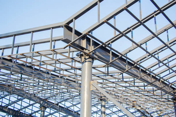 istock New residential construction home metal framing against a blue sky. 1313325130