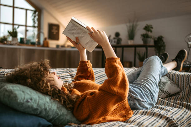 istock Weekend activities. Reading book at home 1313325335