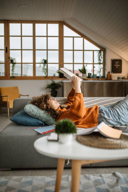 istock Weekend activities. Reading book at home 1313325337