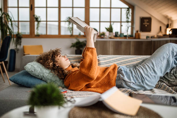 istock Weekend activities. Reading book at home 1313325349