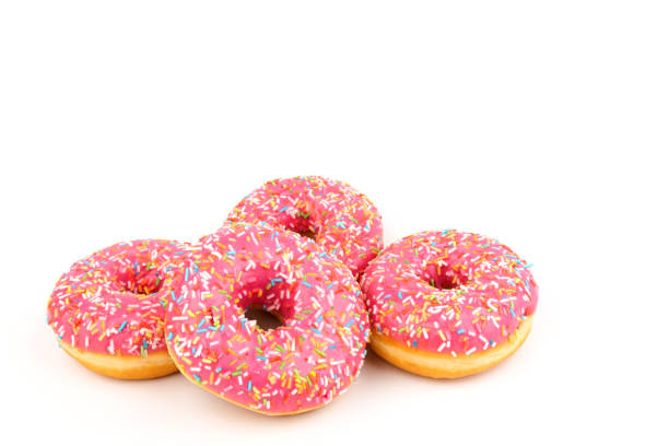 istock Fresh made Donuts isolated on white background. Doughnuts are traditional sweet pastries. Copy space for text. 1313325395