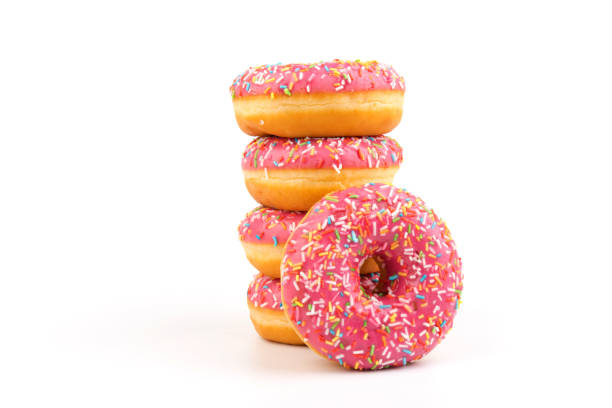 istock Fresh made Donuts isolated on white background. Doughnuts are traditional sweet pastries. Copy space for text. 1313325397