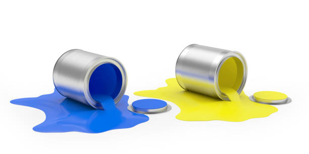 istock Two open cans and spilled blue and yellow paint 1313326770