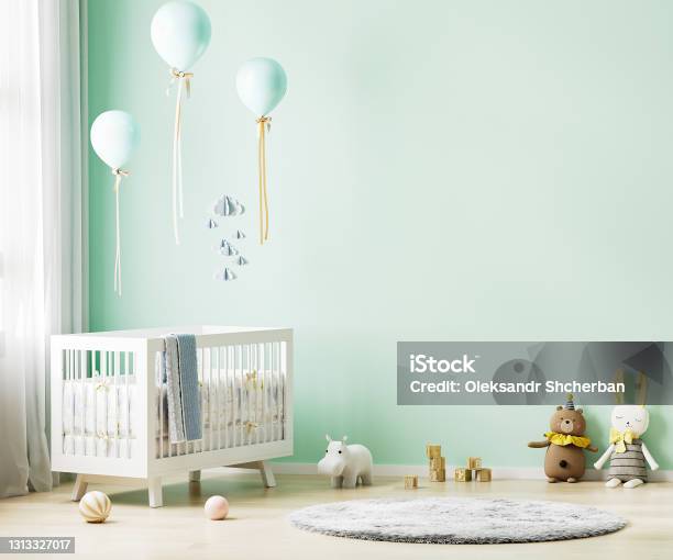 Green Nursery Room Interior Background With Baby Bedding Toys Balloons Nursery Mock Up Kids Room Interior 3d Rendering Stock Photo - Download Image Now