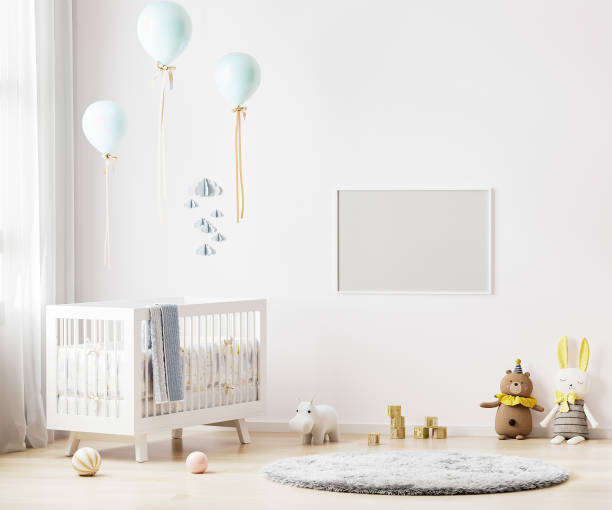 istock Blank horizontal frame mock up on white wall in nursery room interior background with baby bedding, soft toys, balloons, 3d rendering 1313327031