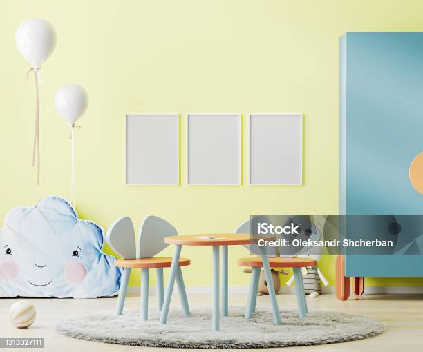 Poster Frame Mock Up In Bright Yellow Child Room With Table Toys And Cupboard Kids Room Interior Mockup Children Playroom 3d Rendering Stock Photo - Download Image Now