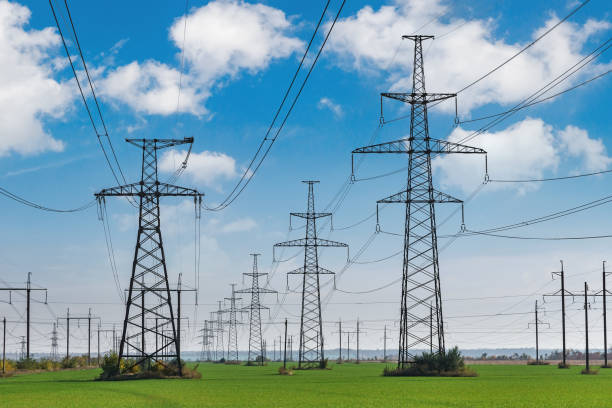istock power lines in the spring in a green wheat field 1313328367