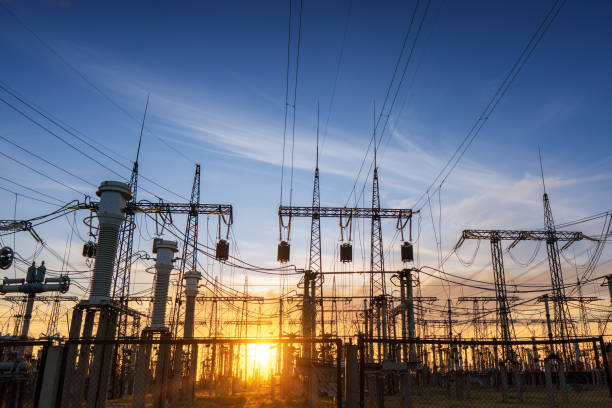 istock power line pylons during sunset with beautiful saturated sky. distribution transmission and consumption of electricity 1313328416