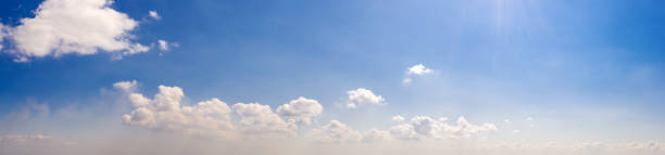 istock Wide sky panorama with scattered cumulus clouds 1313328673