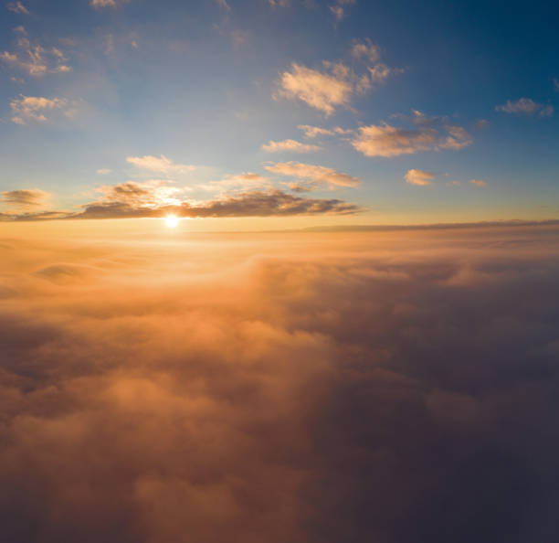 istock view from an airplane on a beautiful saturated sunrise above the clouds 1313328685