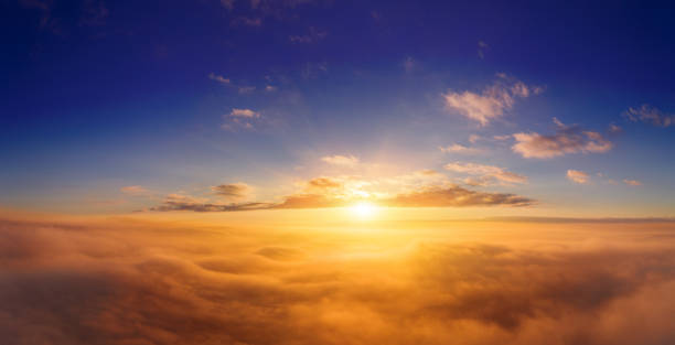 istock view from an airplane on a beautiful saturated sunrise above the clouds 1313328696