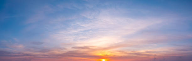 istock panoramic sunrise with cirrus clouds illuminated by the rays of the sun 1313329082