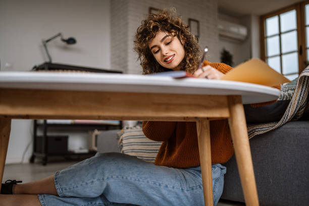 istock Young woman doing home finances at home 1313329552
