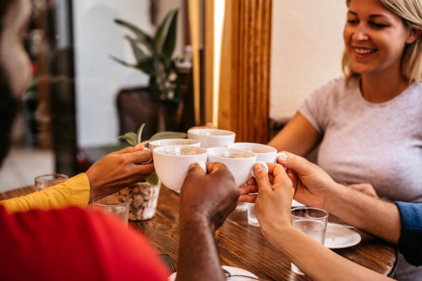 istock Friends toasting coffee drink at coffee shop 1313329722