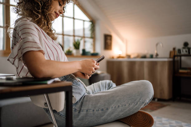 istock Young businesswoman using smartphone dealing with working tasks 1313329728