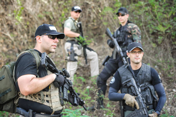 istock Army soldiers in action tactical combat shooting from machine gun 1313333221