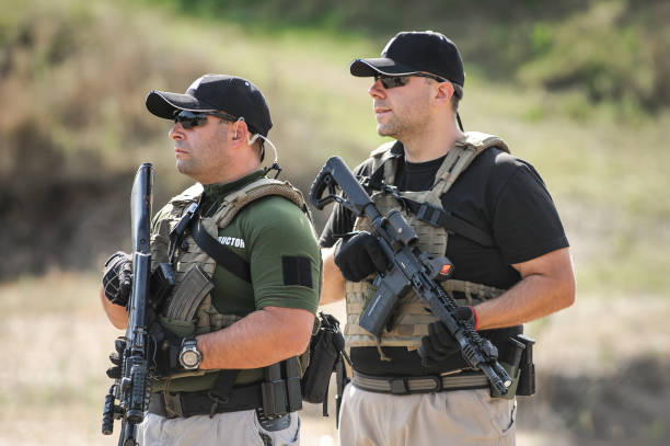 istock Army soldiers in action tactical combat shooting from machine gun 1313333294