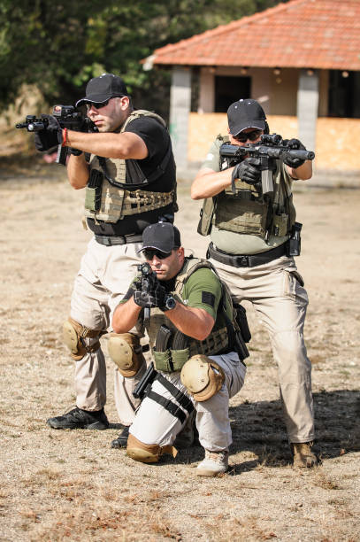 istock Army soldiers in action tactical combat shooting from machine gun 1313333322