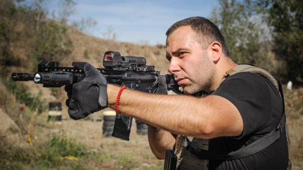 istock Army soldier in action tactical combat shooting from machine gun 1313333398