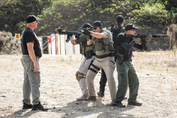 istock Army soldiers in action tactical combat shooting from machine gun 1313333417
