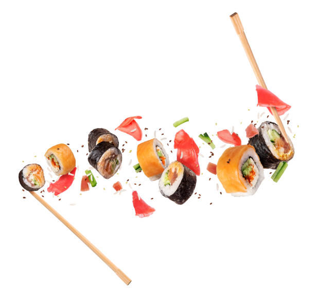 istock Fresh sushi rolls with ingredients in the air, isolated on white background 1313337470