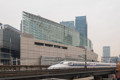 Tokyo, Japan - December 10, 2015: Tokyo International Forum with Shinkansen at Yurakucho Station, Chiyoda-ku, Tokyo, Japan
