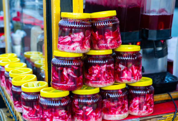 istock Glass jars with traditional Turkish pickles Salgam for sale 1313340072