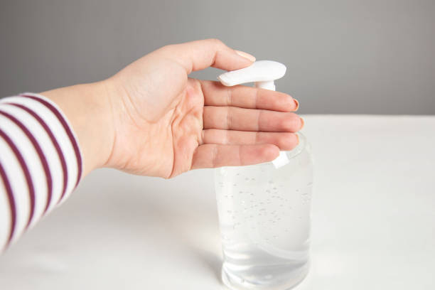 istock Woman hand using alcohol wash gel 1313342852