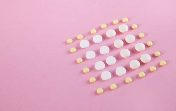 istock Pills are isolated on pink background. 1313344050