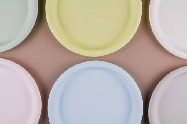 istock set of plastic reusable colorful plates on the kitchen table 1313346849