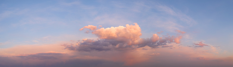 panorama of a bright dramatic twilight sky, beautiful clouds at dawn.