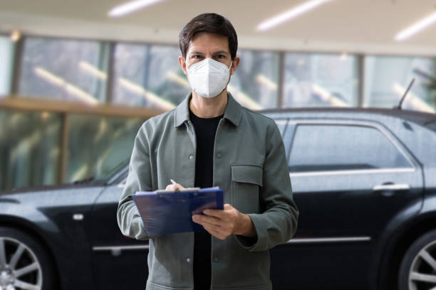 istock Car Sale In Mask. Salesman 1313347997