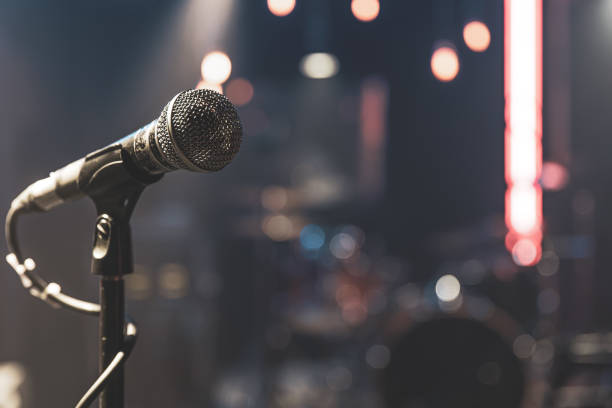 istock Close up microphone on blurred background with bokeh. 1313348200