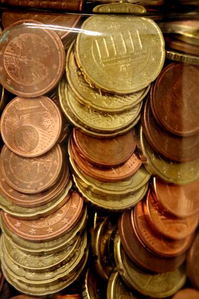 istock glass full of coins 1313348237