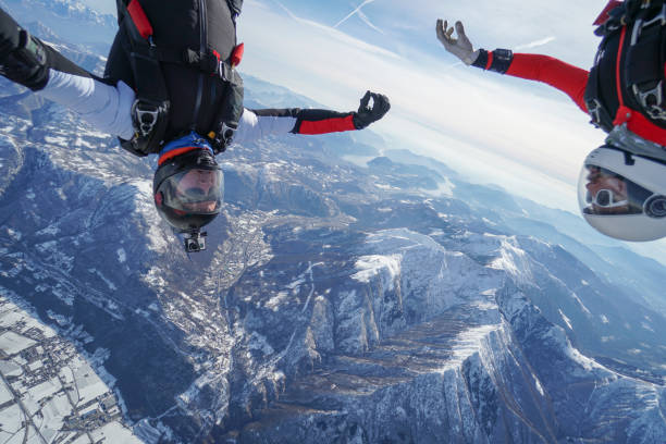 istock Freefall jumpers soar above Swiss mountain landscape 1313349576
