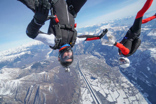 istock Freefall jumpers soar above Swiss mountain landscape 1313349695