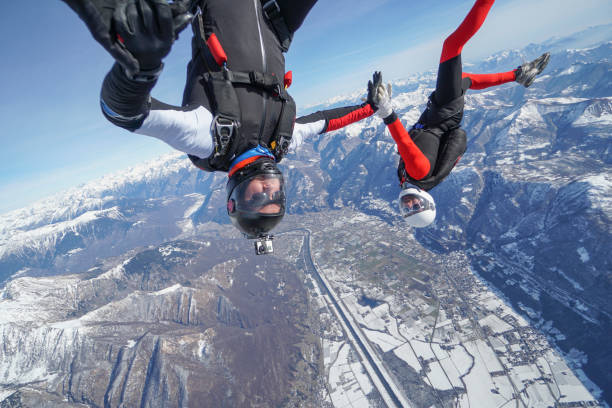 istock Freefall jumpers soar above Swiss mountain landscape 1313349698