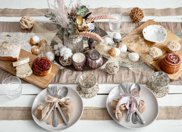 istock Easter table setting with decor details and homemade cakes top view. 1313350390