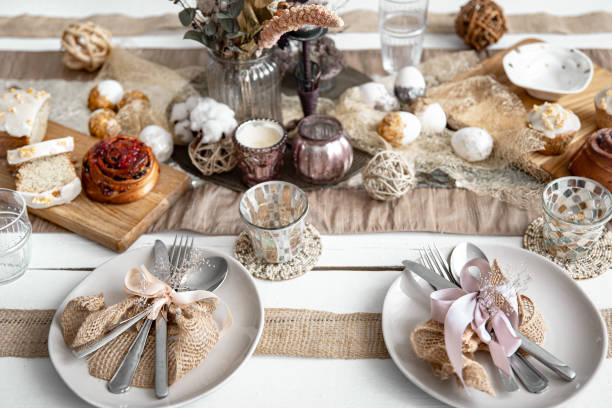 istock Easter table setting with decor details and homemade cakes top view. 1313350400