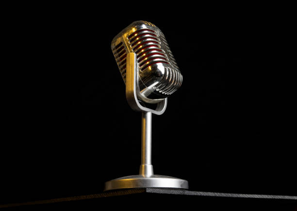 istock Vintage retro Microphone closeup view with yellow light 1313350429