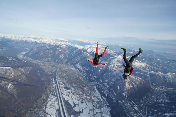 istock Freefall jumpers soar above Swiss mountain landscape 1313350499