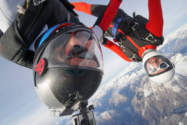 istock Freefall jumpers soar above Swiss mountain landscape 1313350507