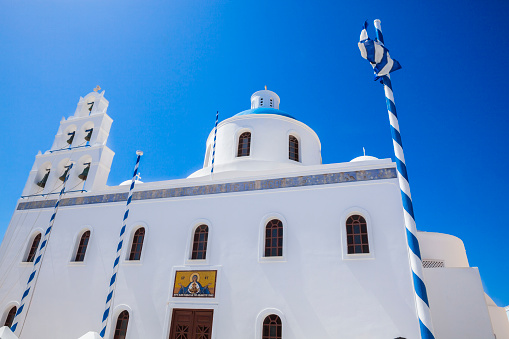 Santorini, Greece - Jully 04, 2018: The Church of Ekklisia Panagia Platsan is an impressive church in Oia. It is located in the heart of the village, on the main square.