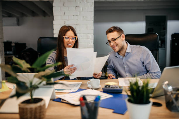 istock Two young businessman having a successful meeting in modern office. 1313352111