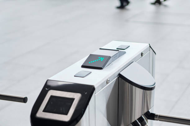 istock Metal turnstile with forward arrow to signal passage permitted. 1313353559