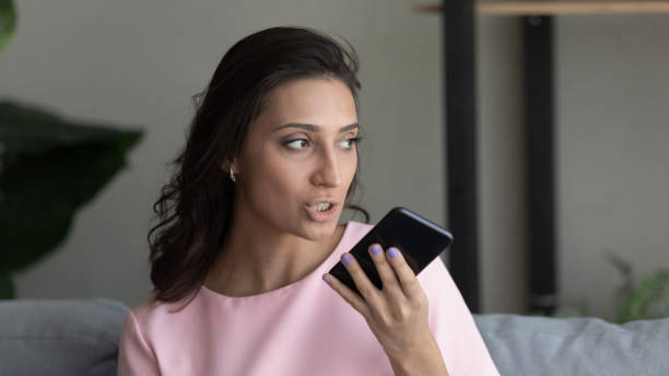 istock Indian lady search information online giving request to digital assistant 1313357881